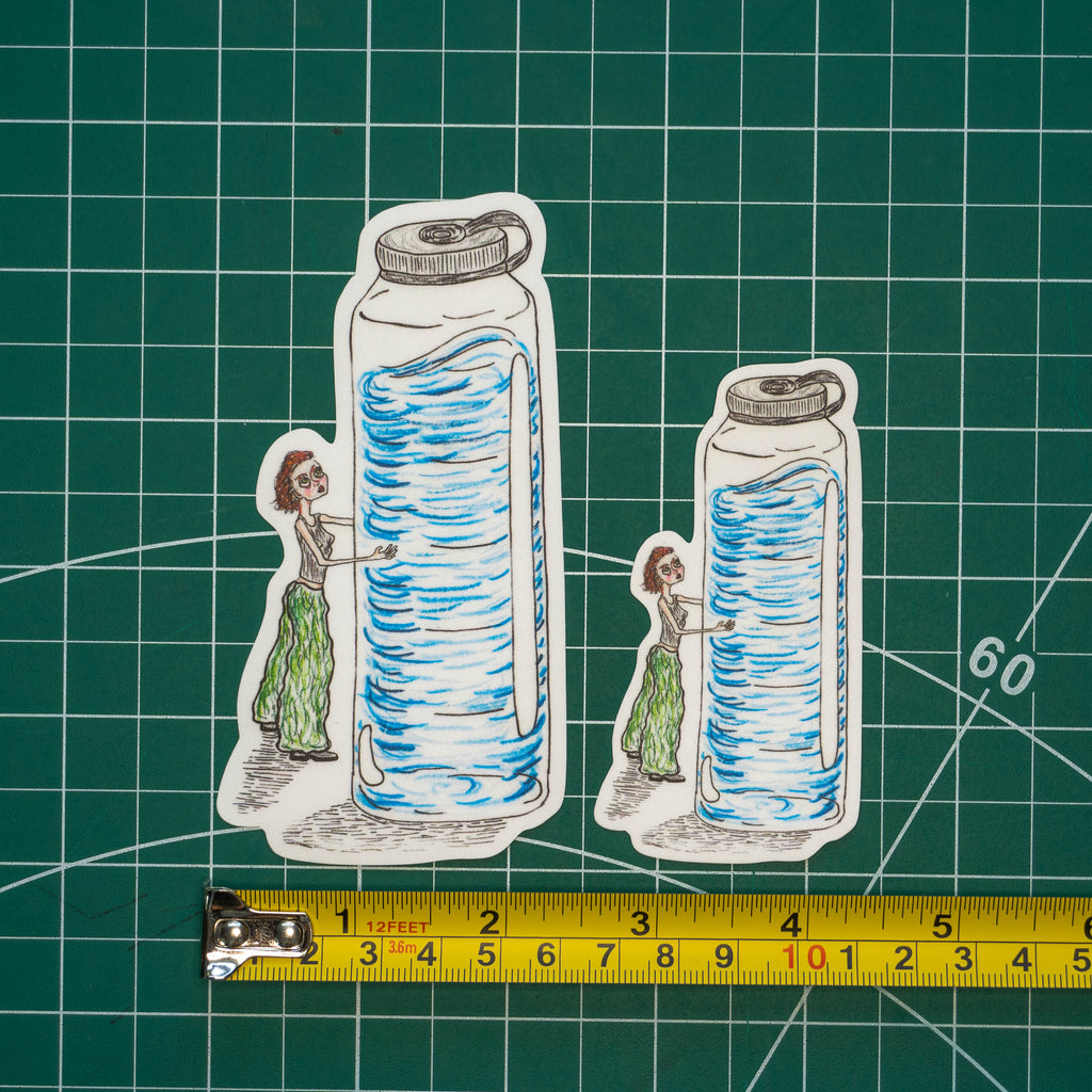 Two differently-sized die-cut stickers featuring an illustrated figure hugging a waterbottle that is twice her size on a green cutting mat with a yellow tape measure below for scale.